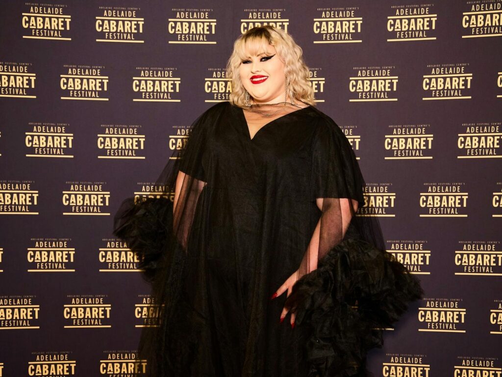 Charlee stands posing in black chiffon at the Adelaide Cabaret Festival